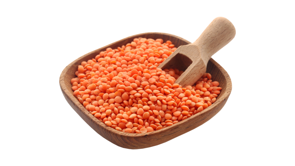 An illustrative image of a wooden bowl of red lentils with a spade