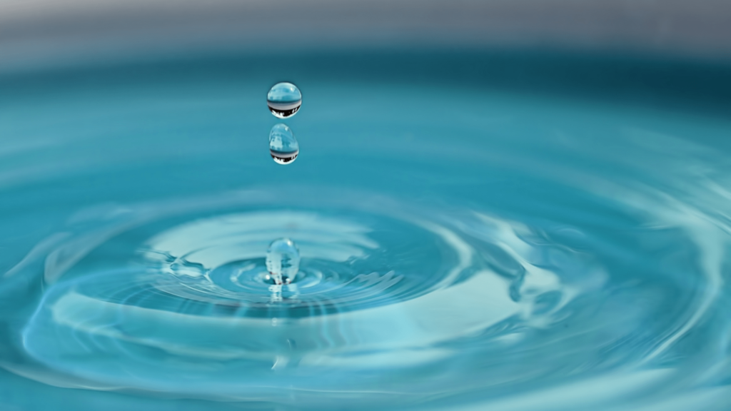 An illustrative image of a drop of water in a pool of water