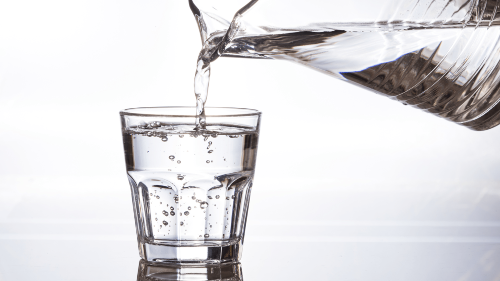 An illustrative image of a glass jug pouring water into a glass