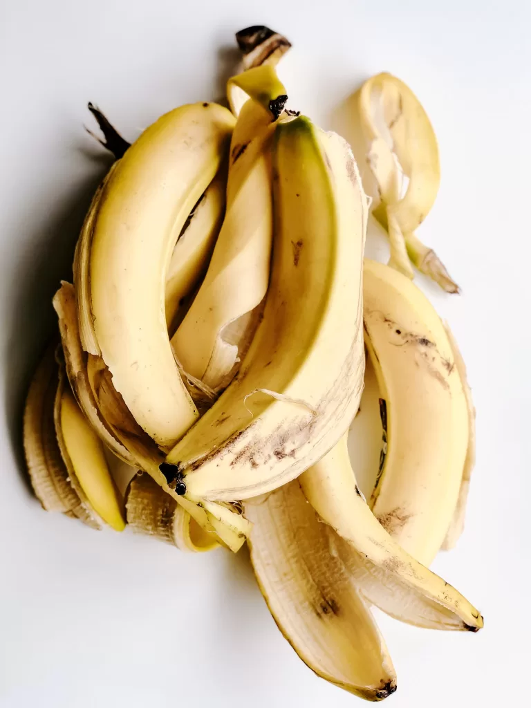 Yellow Banana Peels on White Surface