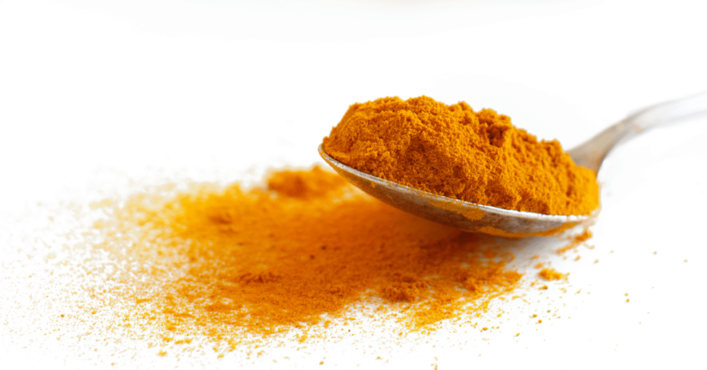 An illustrative image: a spoon of ground turmeric anti-inflammatory, phytochemicals, personalized diet