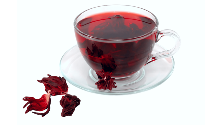 An illustrative image of dried hibiscus tea in a clear cup and saucer on w white background