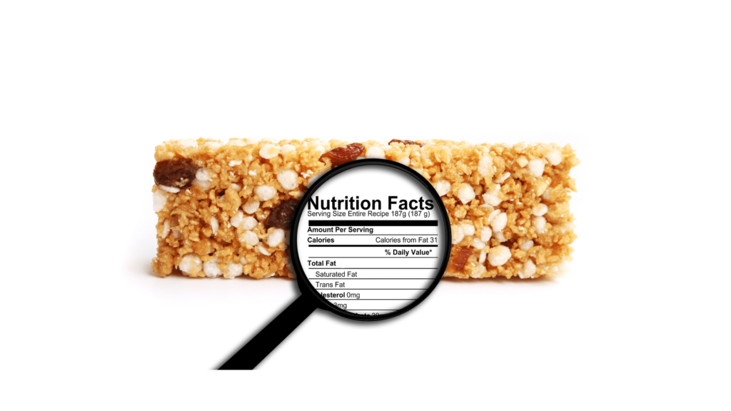 An image of cereal bar on a white background with a magnifying glass emphasising nutritional information